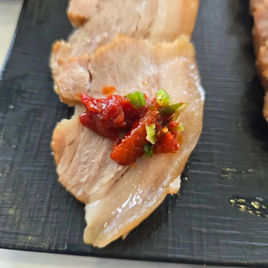 A plate of thickly sliced boiled pork