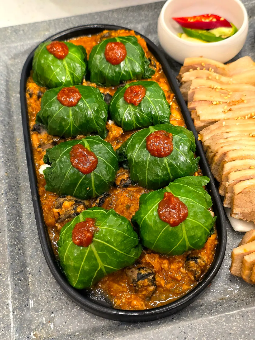 Green lettuce wrap served next to the boiled pork