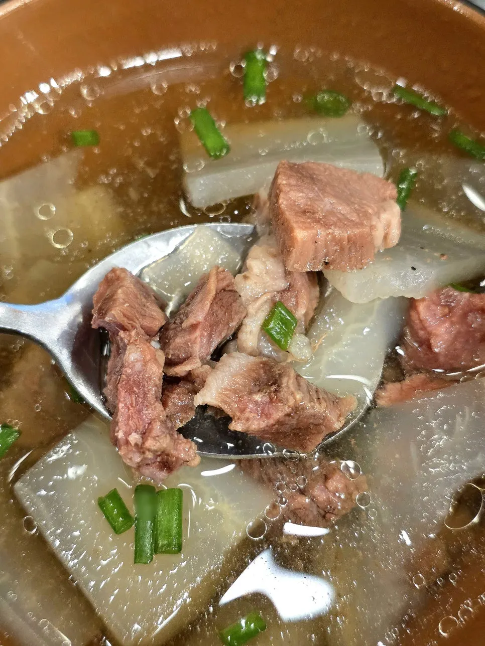 Clear soup with radish and meat