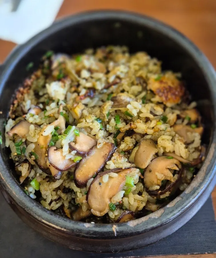 A spoonful of the abalone-mushroom butter hotpot rice mixed together