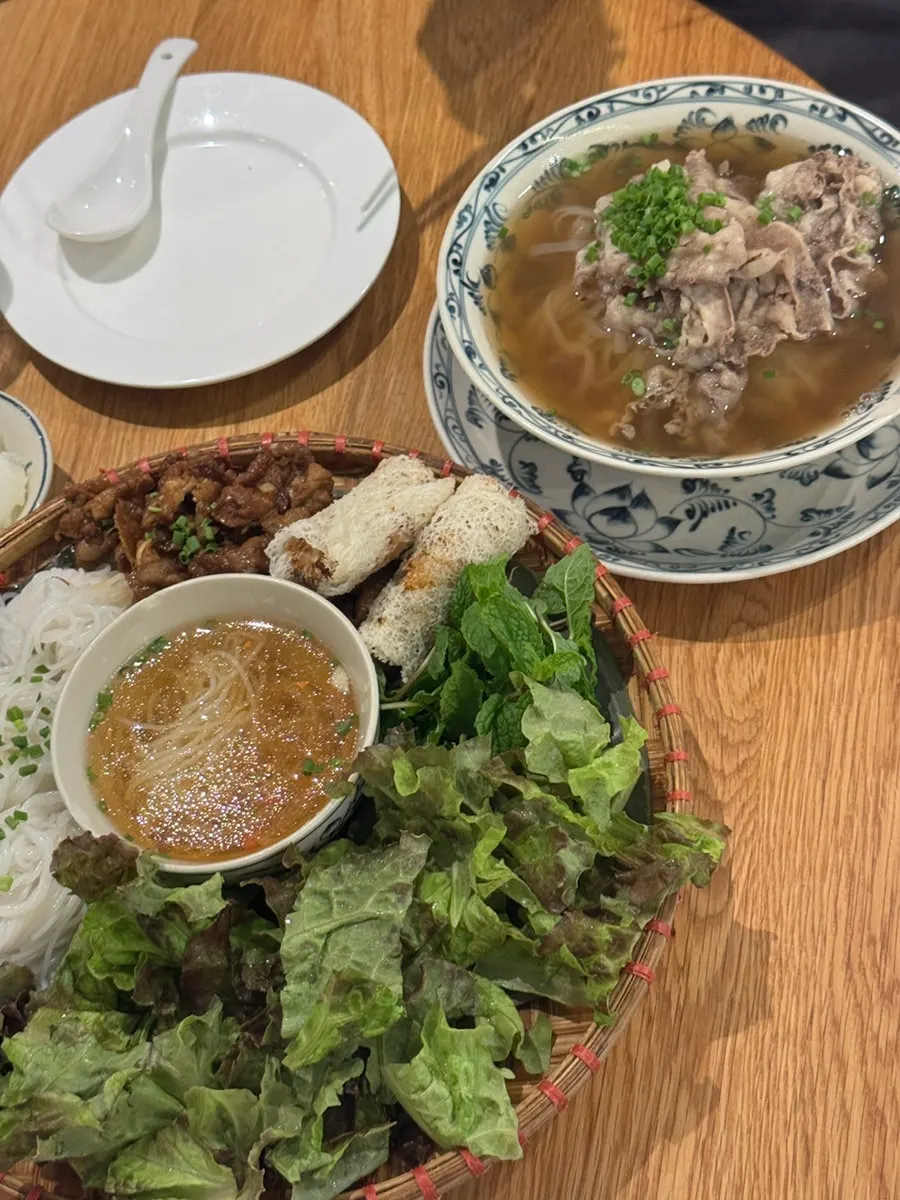 Bun cha served with lettuce, sauce, and grilled meat