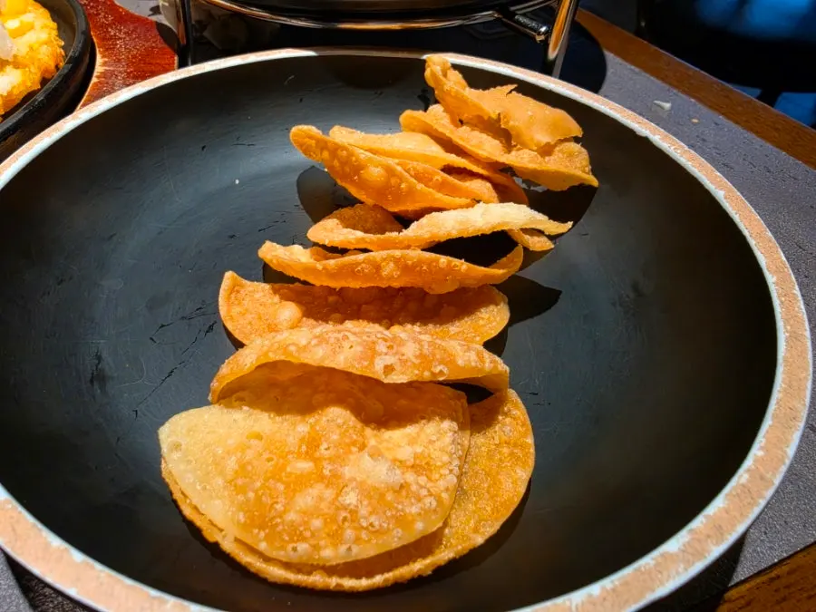 Duck meat placed on cabbage and fried dumpling wrapper