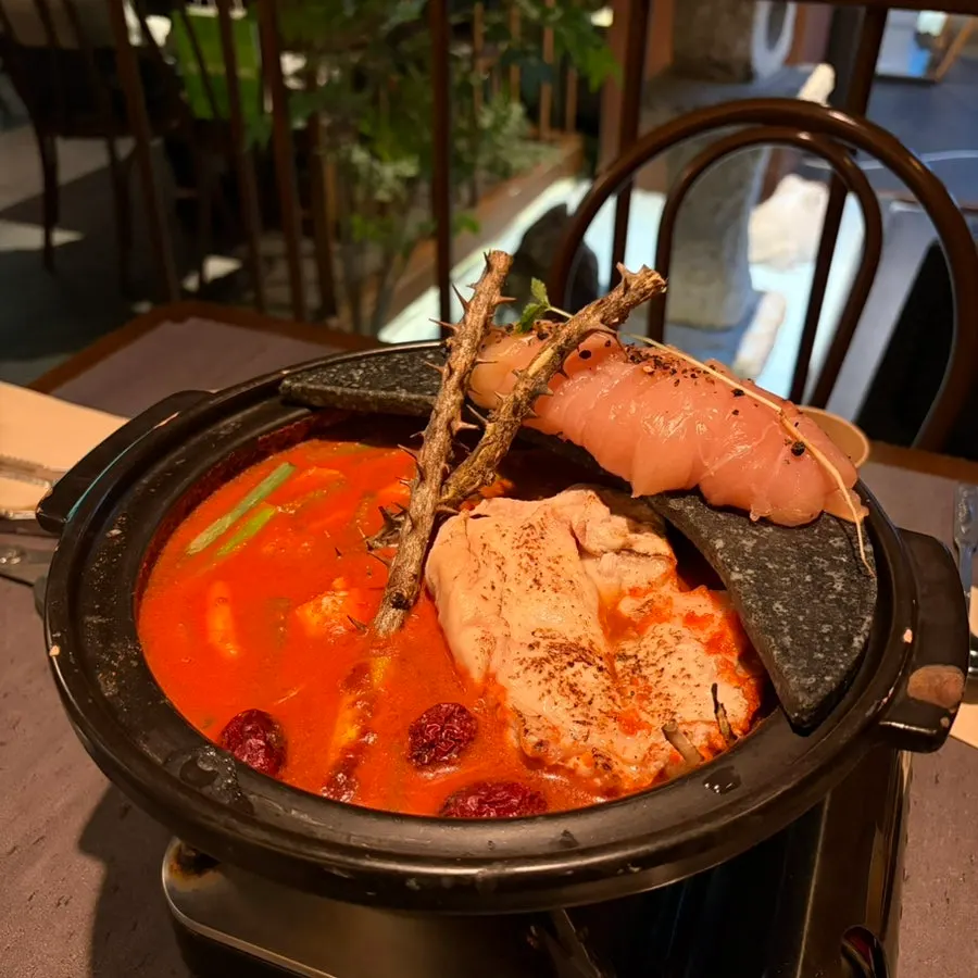Spicy hangover chicken hot pot topped with a decorative tree