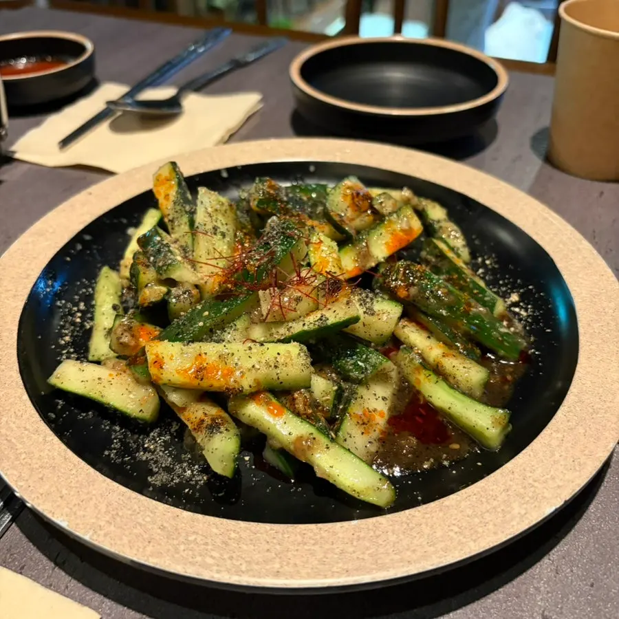 Crunchy cucumbers tossed in black sesame sauce