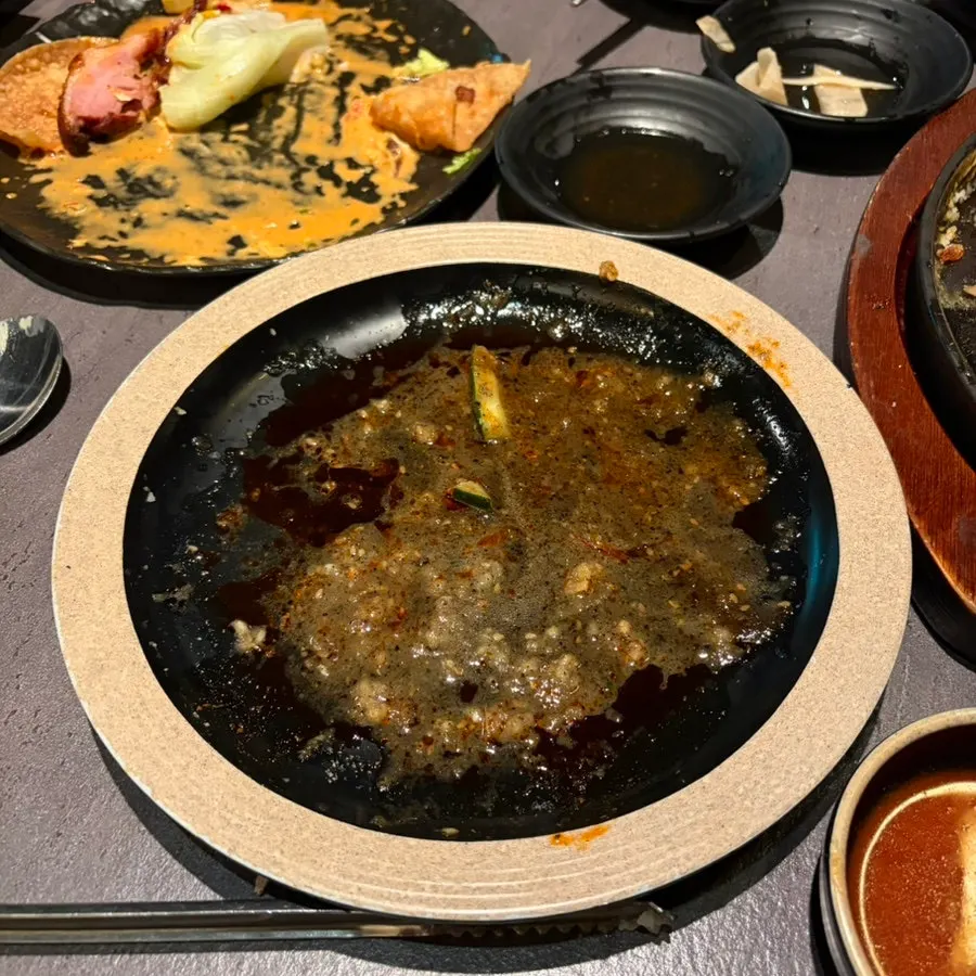 Cross-section of the sauce-covered cheesy potato pancake