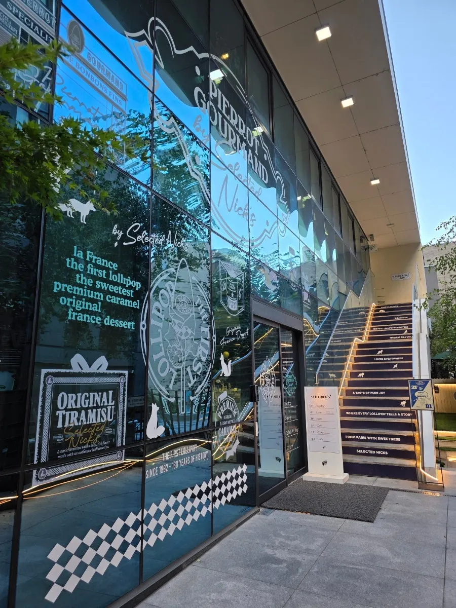 Outdoor chairs and landscaping by the entrance path