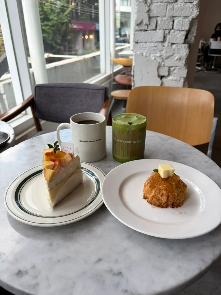 Hot americano served with a spread of desserts