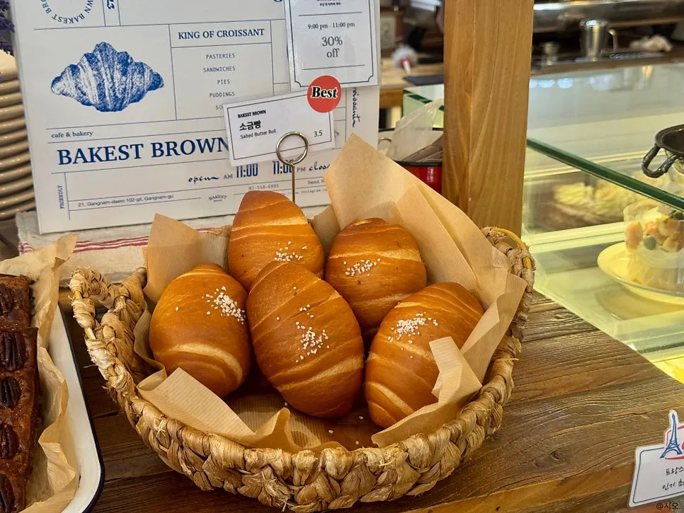 Display case of cream-filled breads and cakes