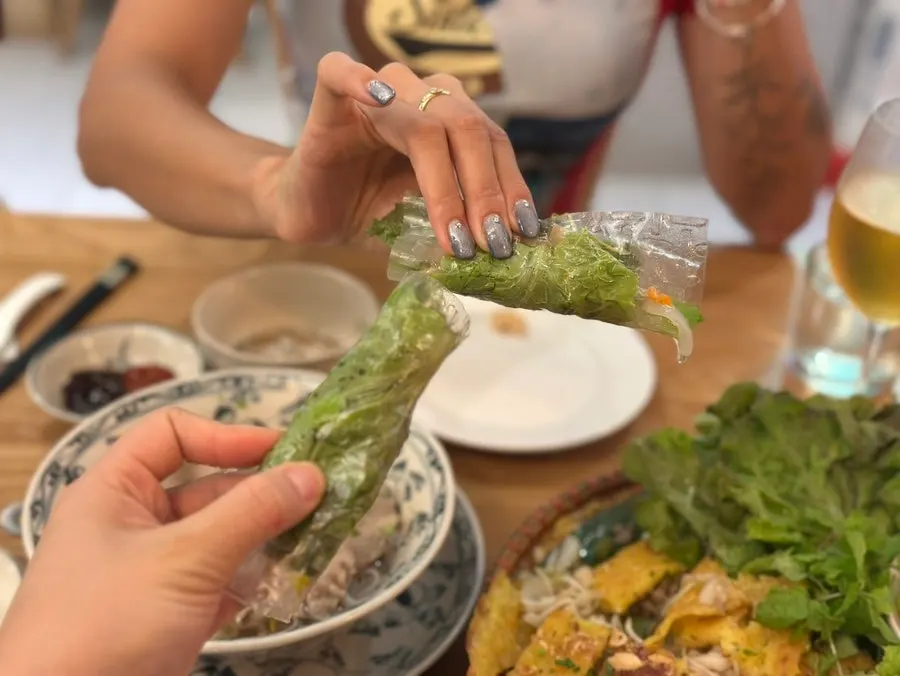 Banh xeo served with lettuce and vegetables