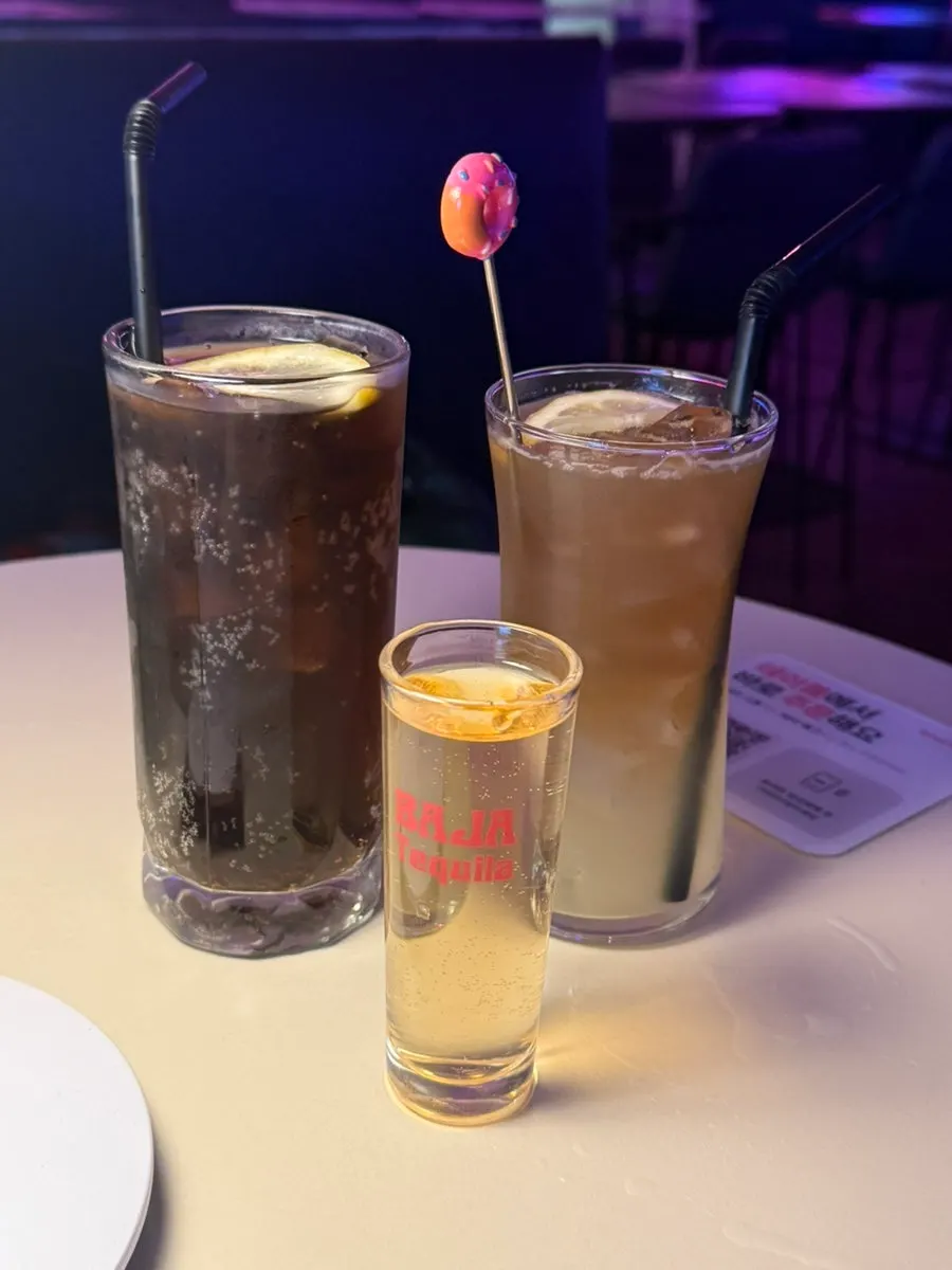 A B LAB cocktail glass sitting on the table