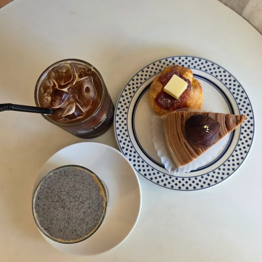 Table set with desserts and drinks at Something About Coffee