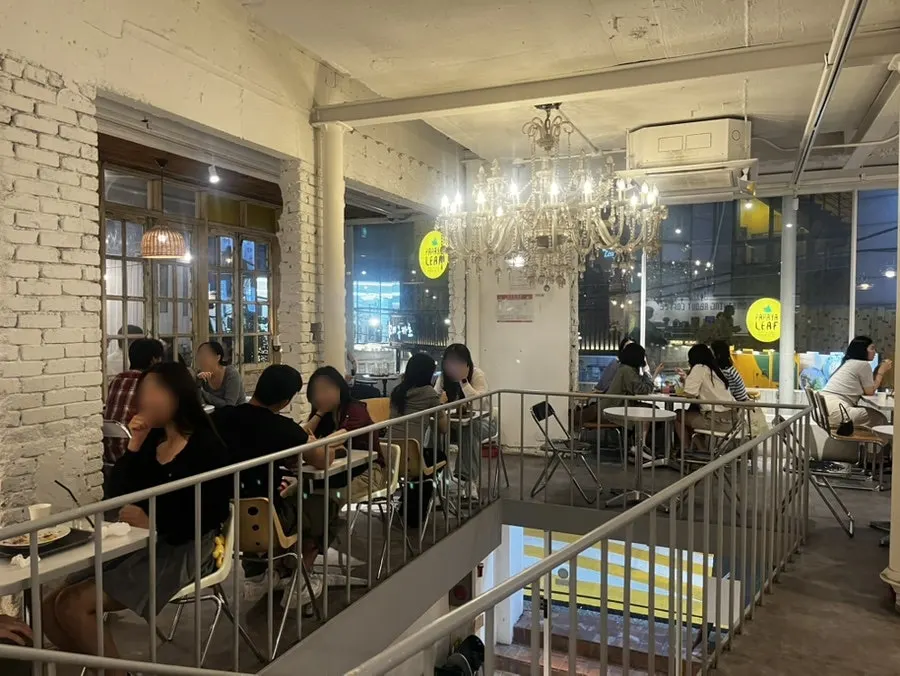 Wide view of the spacious indoor seating at Something About Coffee