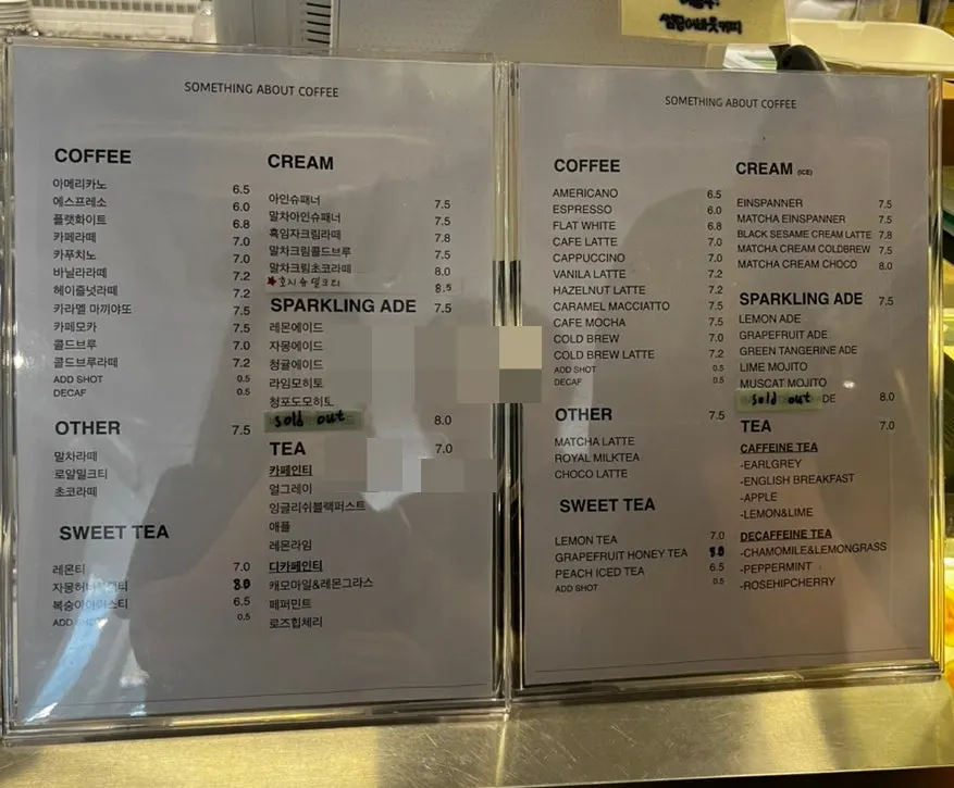 Café menu board listing coffee and desserts