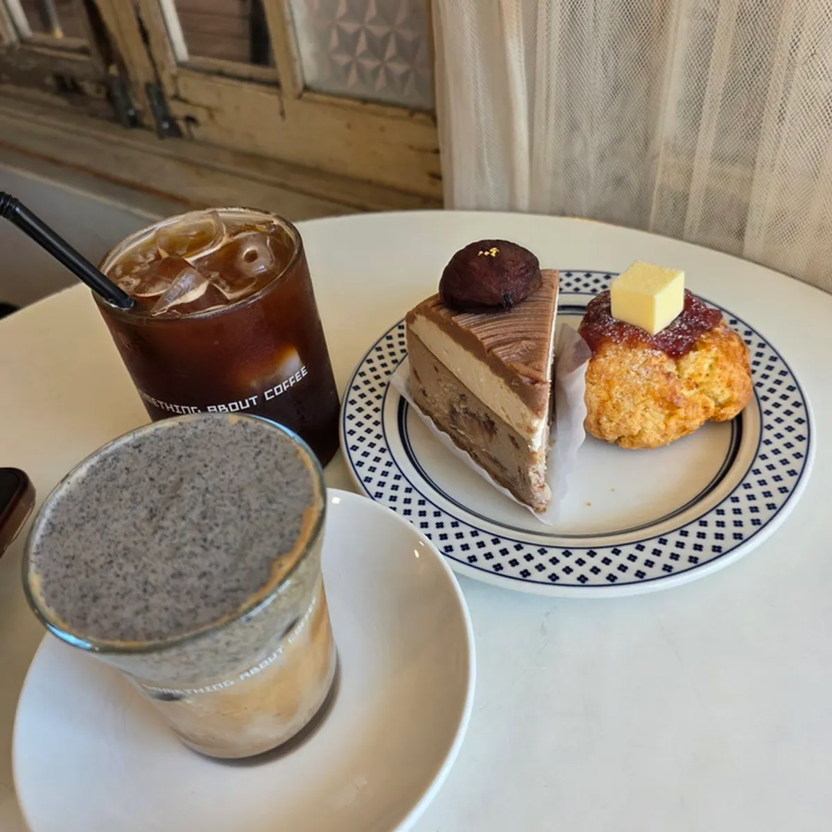 A full spread with the black sesame cream latte and ordered desserts