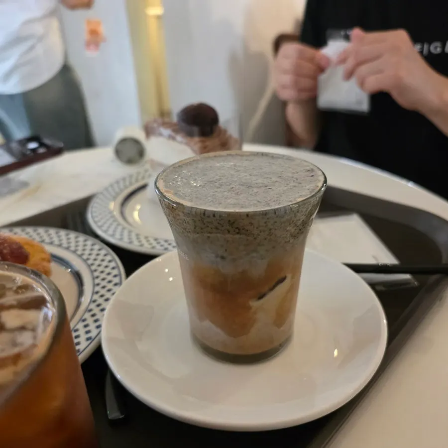 Close-up of the black sesame cream latte before stirring