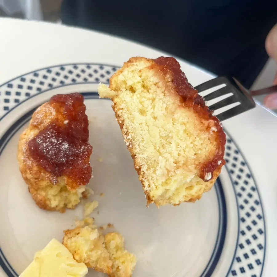 Cross-section of the strawberry butter scone cut with a knife