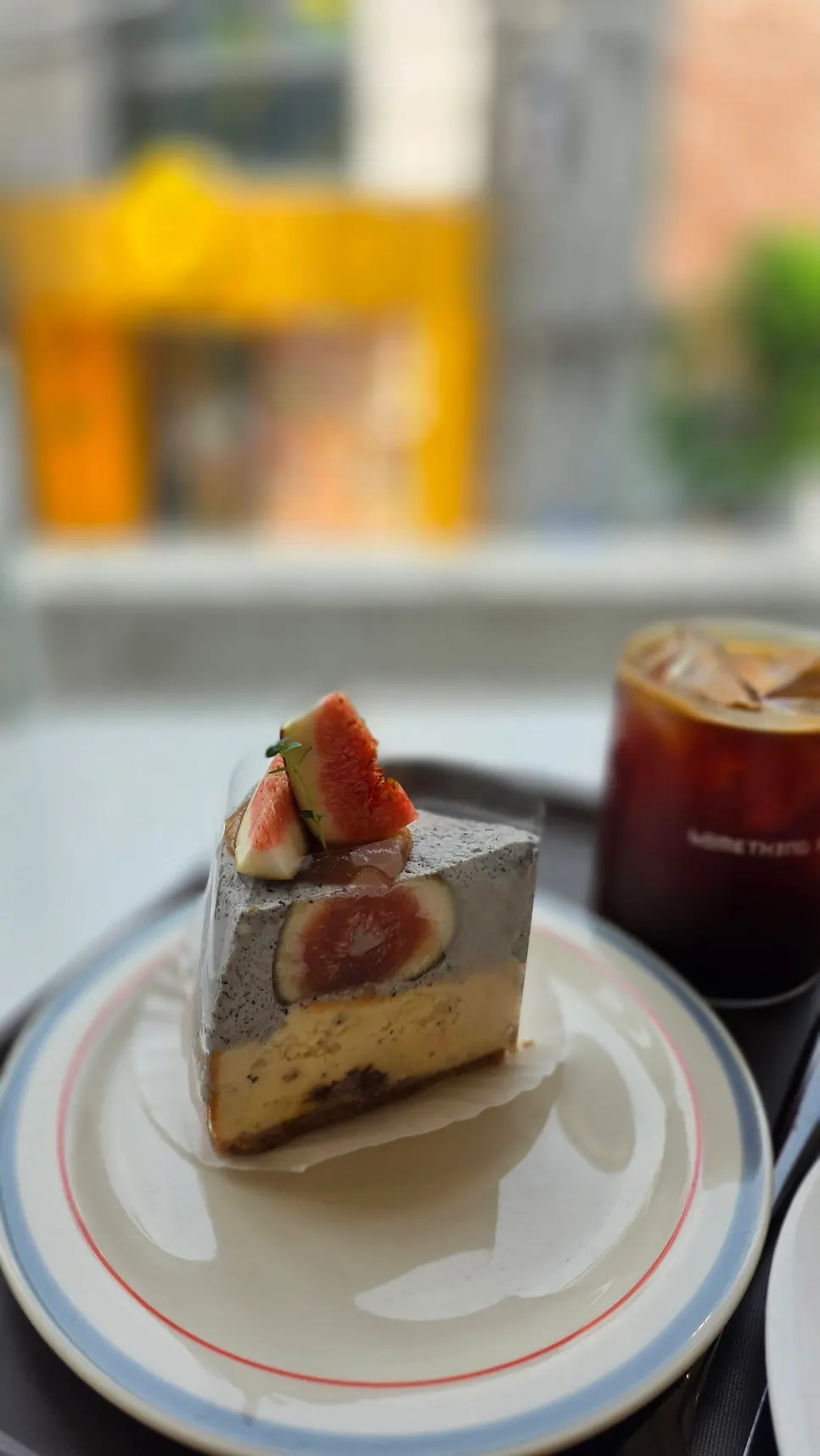 Two dessert plates and two drinks set on the table