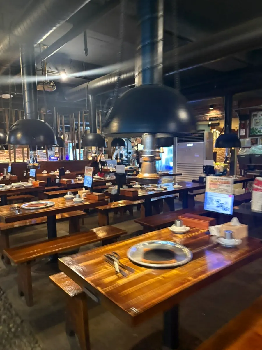 Classic charcoal grill restaurant atmosphere near the entrance