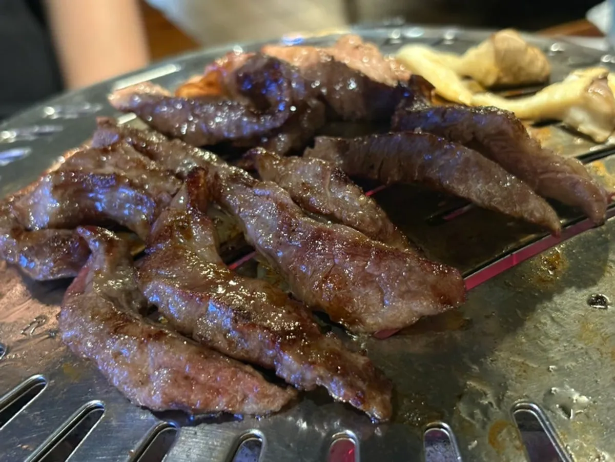 Close-up of charcoal-grilled meat at Bongu Hwarro