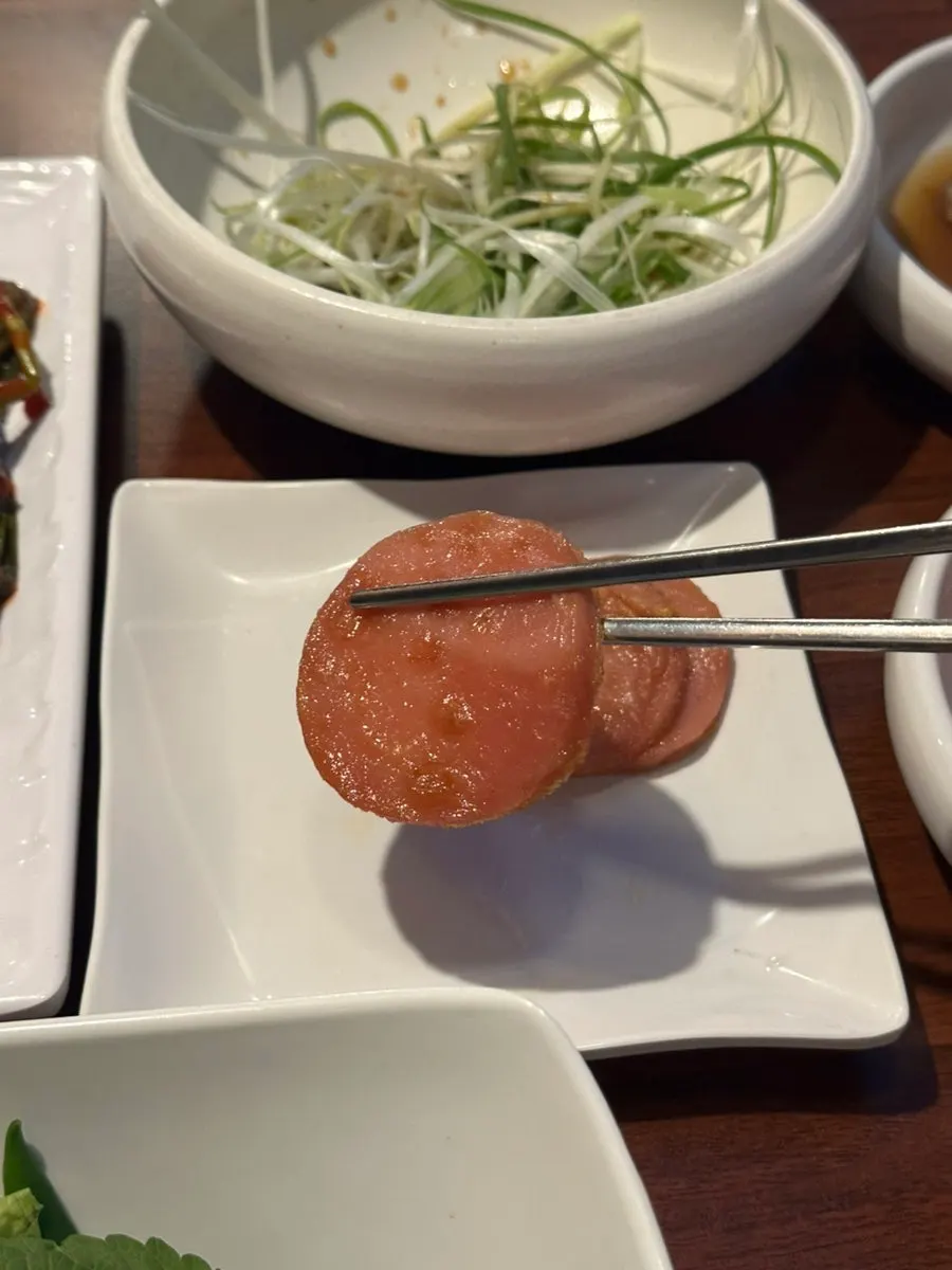 Pink sausages served as a basic side dish