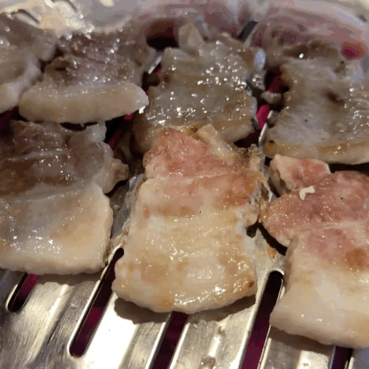 A piece of pork belly infused with charcoal aroma