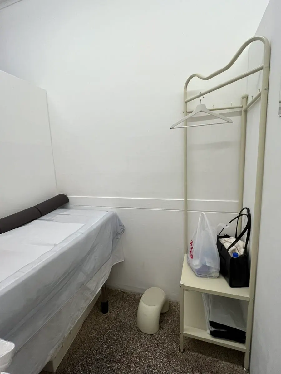 Waxing bed lined with disposable hygiene sheets