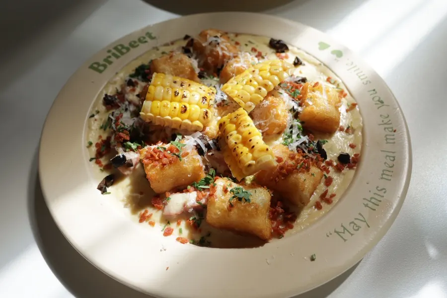 Corn Cream Gnocchi topped with cream and corn