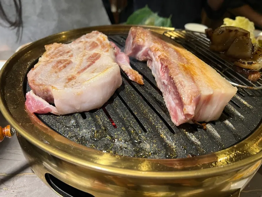 Thick pork belly and pork skin on the charcoal grill