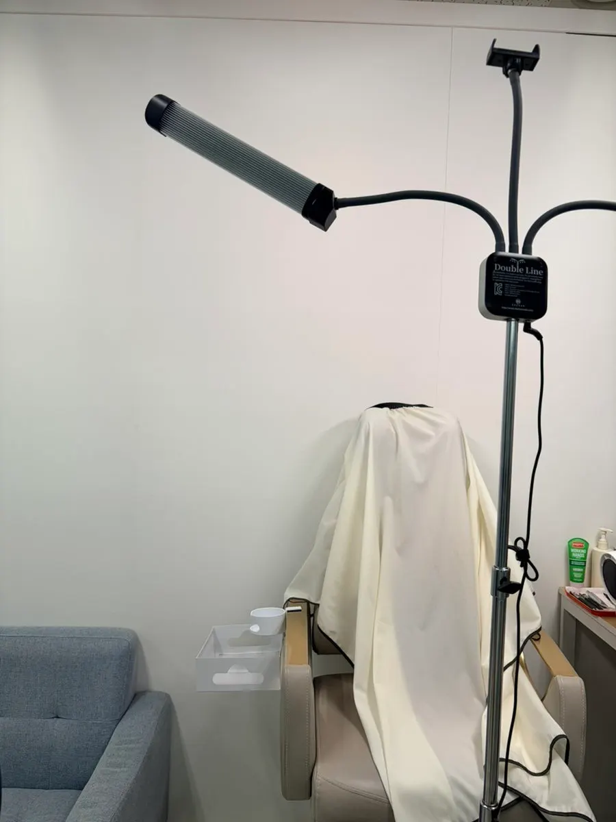 Trimming the eyebrow with a razor