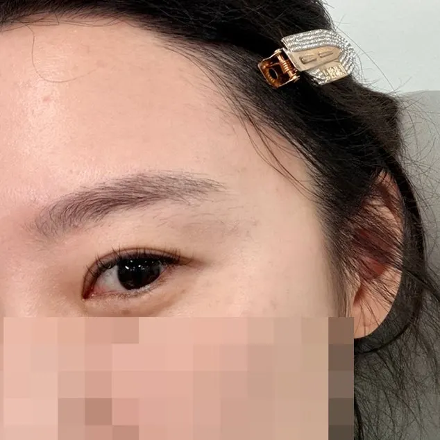 Eyebrow with stray hairs before grooming