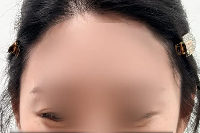 Smiling face after eyebrow grooming