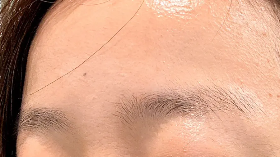 Eyebrow design consultation and hair-direction check