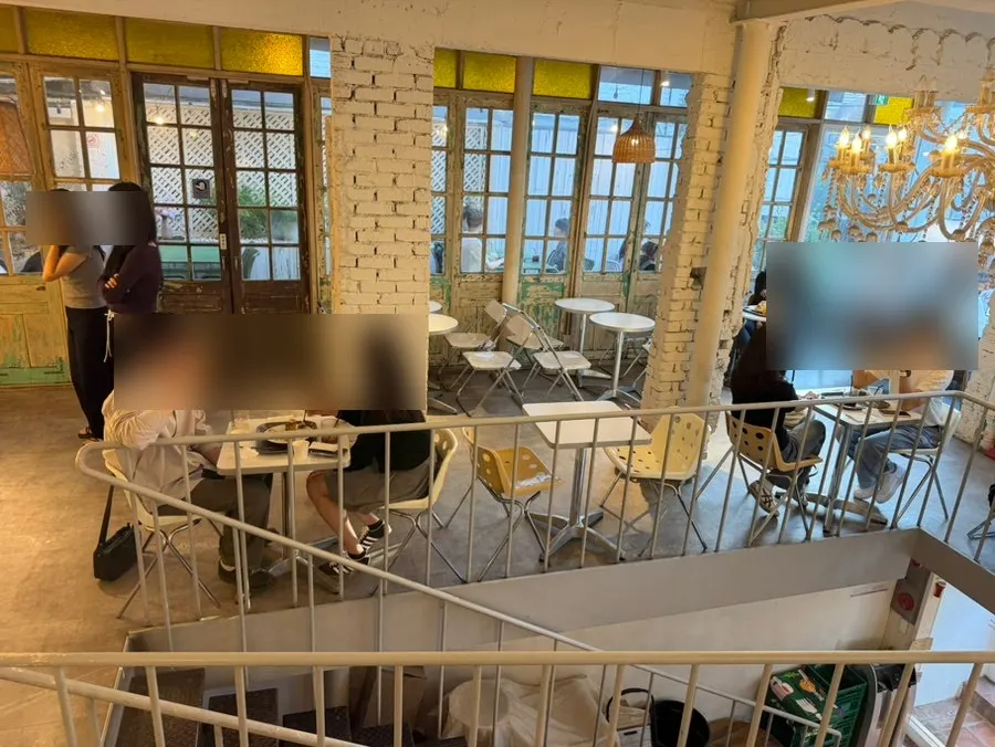 Seating on the 2nd floor of Something About Coffee