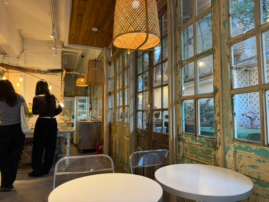 Outdoor seating on the 2nd floor of Something About Coffee
