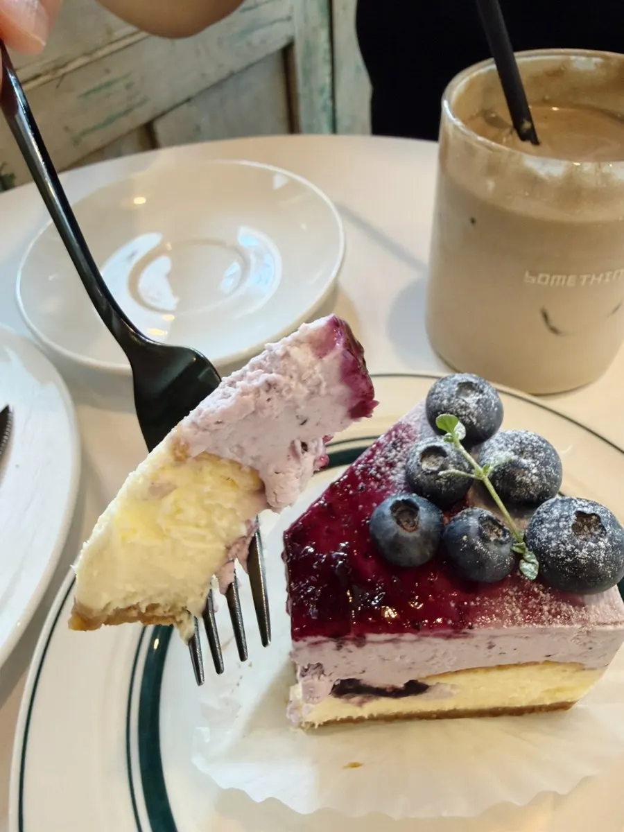Spread of desserts and drinks at Something About Coffee