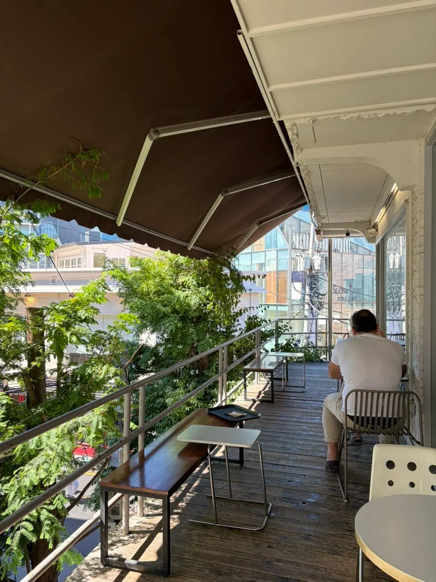 Terrace at Upper and Under with trees visible