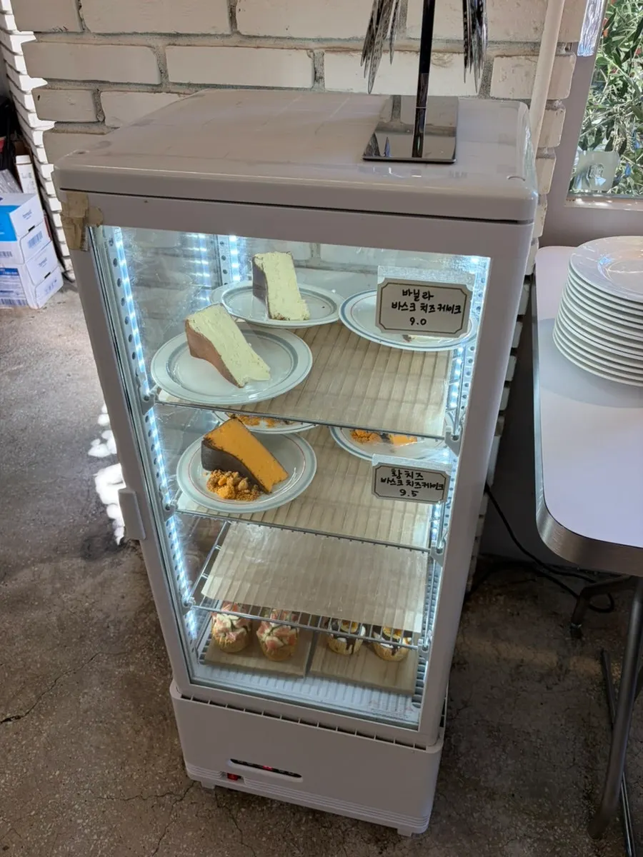 Slice cake display case at Upper and Under