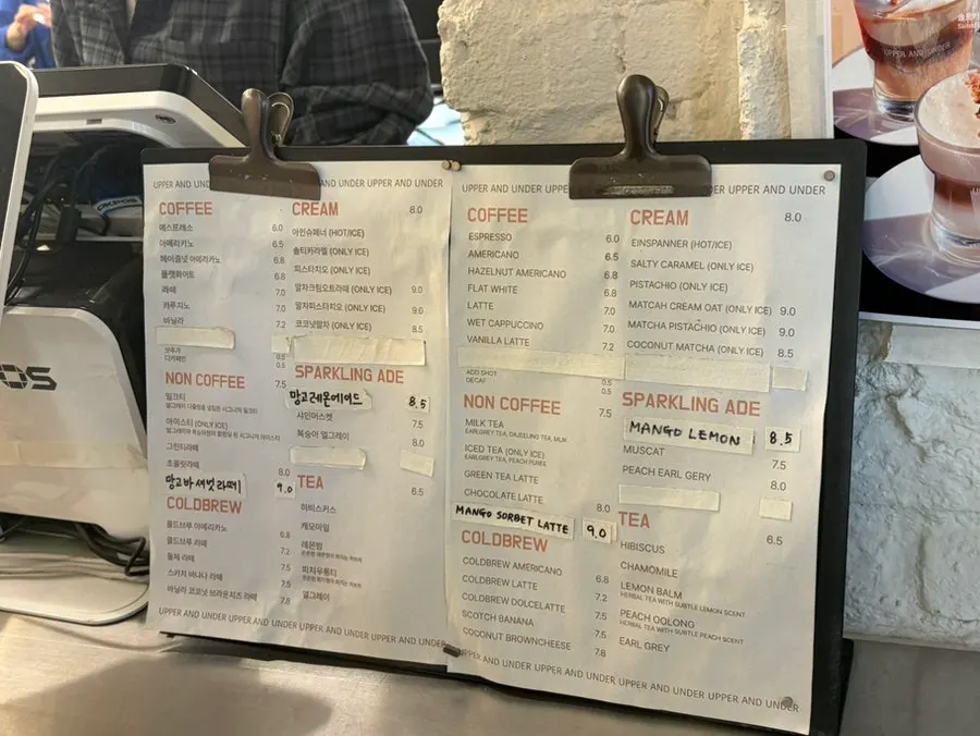 Drink menu board at Upper and Under
