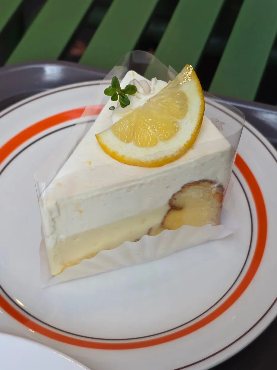 Lemon yogurt gâteau cake topped with fresh cream