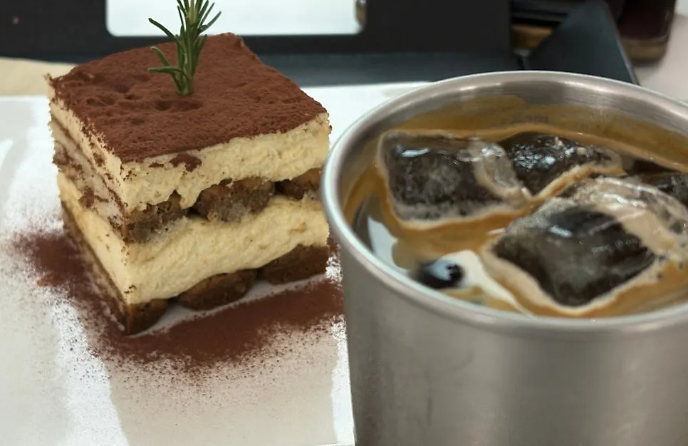 Tiramisu and americano set on the table