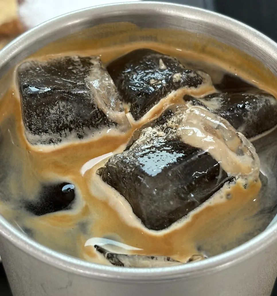 Close-up of the dessert and coffee pairing