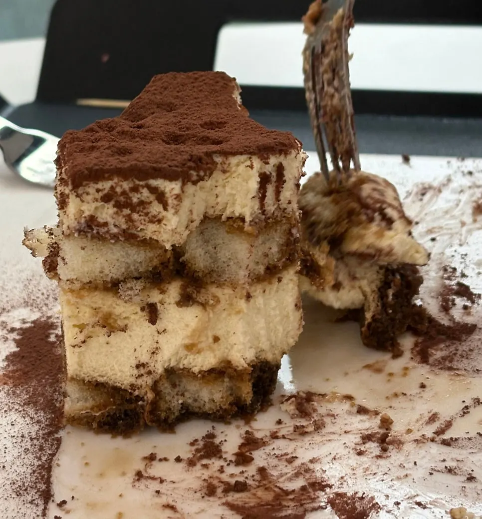 A forkful of tiramisu showing its texture