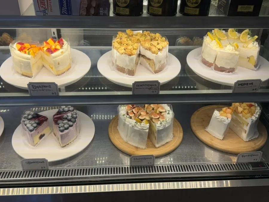 Cake showcase topped with fresh fruit