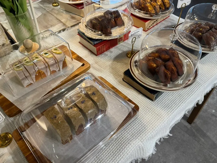 Bakery counter with scones, financiers, and madeleines
