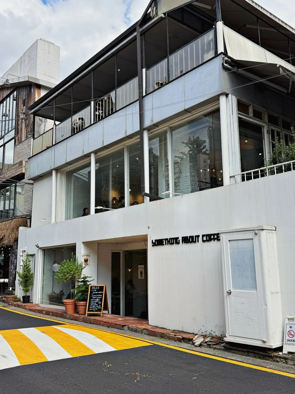 White-toned exterior of the Something About Coffee building