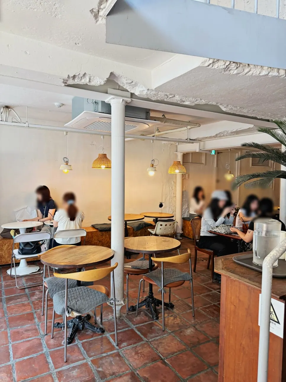 Outdoor terrace seating and entrance at Something About Coffee