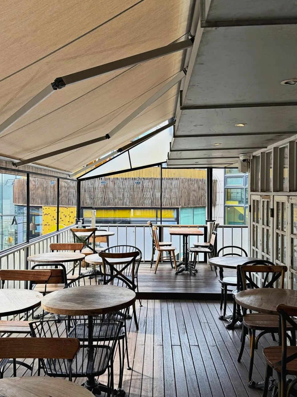 View of the outdoor terrace seating at Something About Coffee