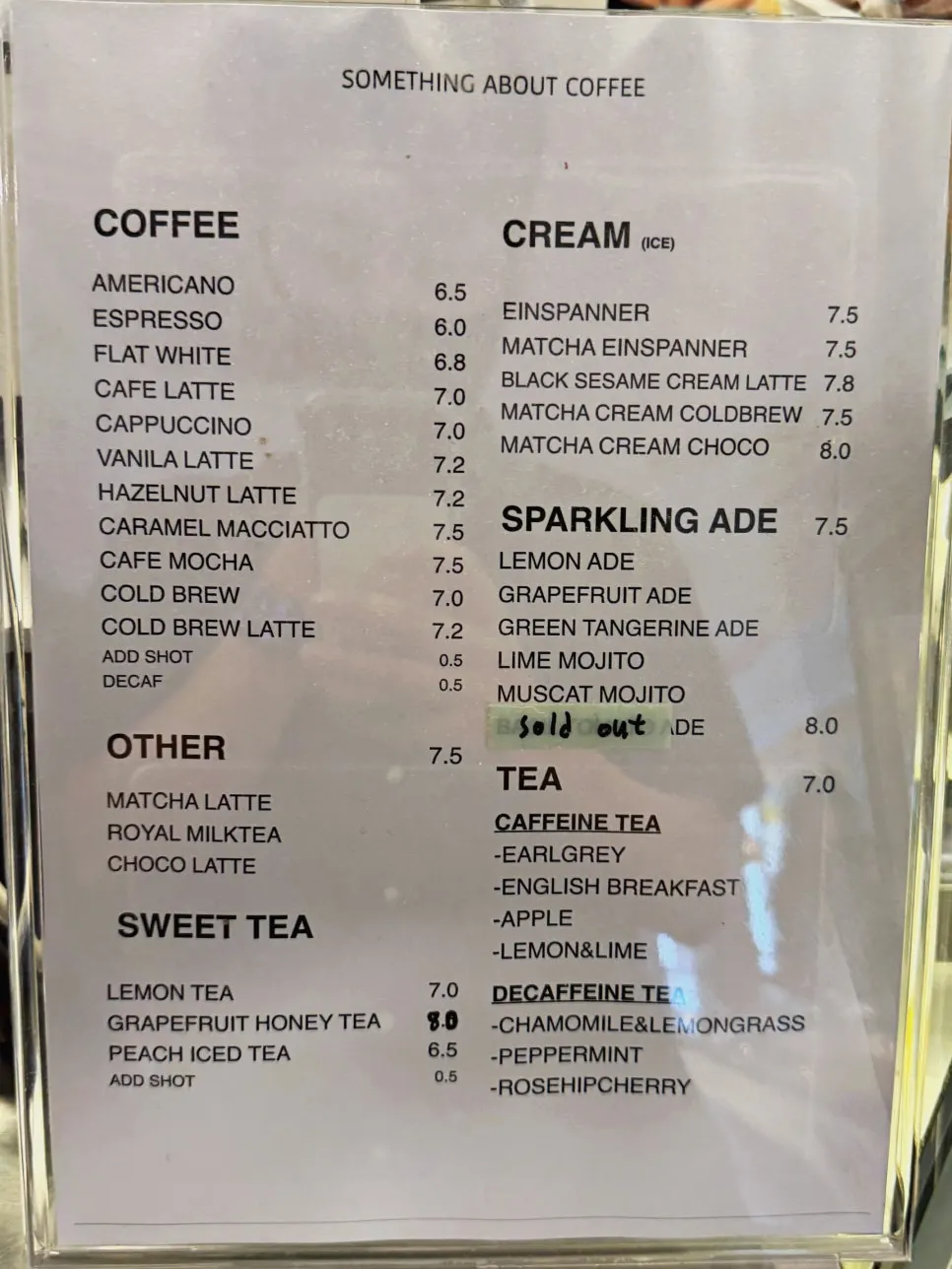 Drink menu board at Something About Coffee