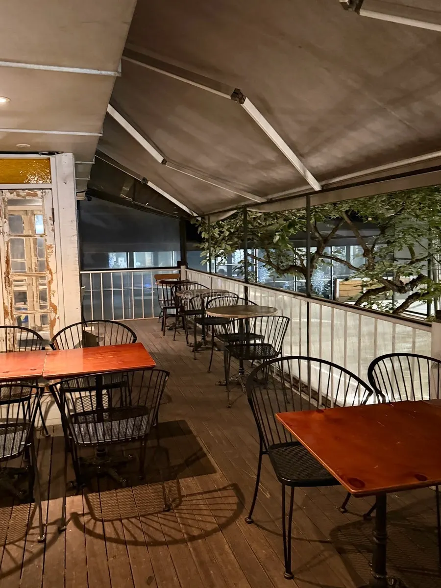 Indoor seating on the 1st floor of Something About Coffee