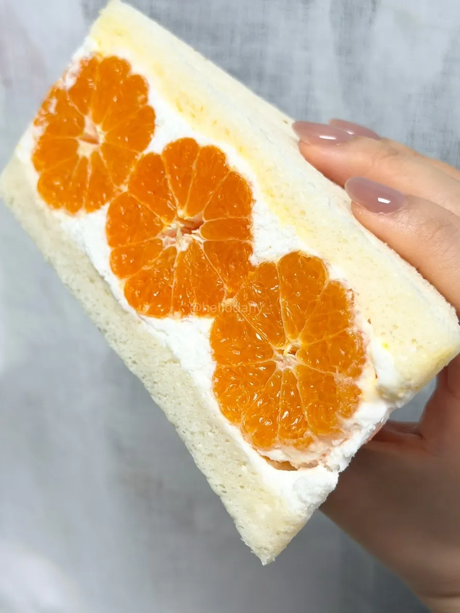 Cross-section of the tangerine sando showing a whole tangerine inside